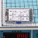 Glass Fuse Box on Blue Grid Scale.webp